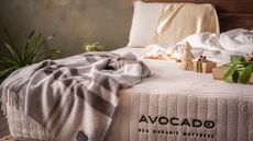 bed with avocado logo on it