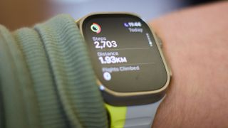 Apple Watch Ultra 2 displaying a step count and distance