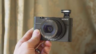 Sony Cybershot RX100 point-and-shoot camera in the hand